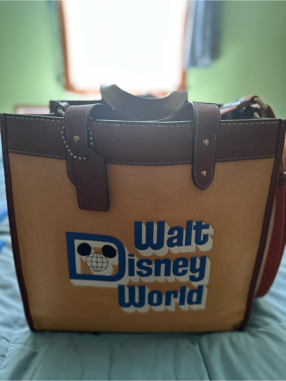 Disney Coach Brown Walt Disney World Logo Shopper Tote with Blue Accents.